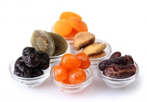 Dried fruits in bowls isolated on white