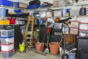 Residential garage full of junk and storage.