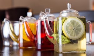 three square teapots with different colors fruit tastes of tea