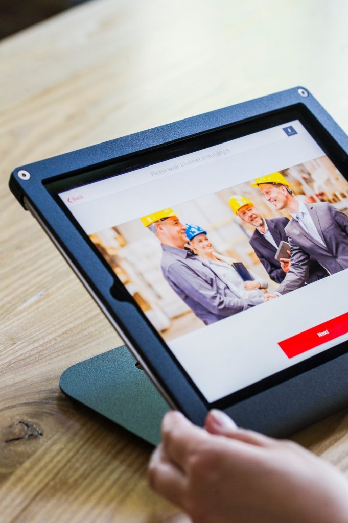 Person viewing safety training materials on a tablet